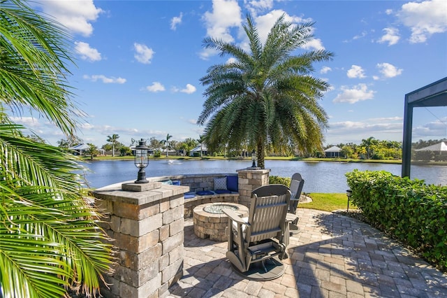 view of patio / terrace featuring a water view and an outdoor fire pit