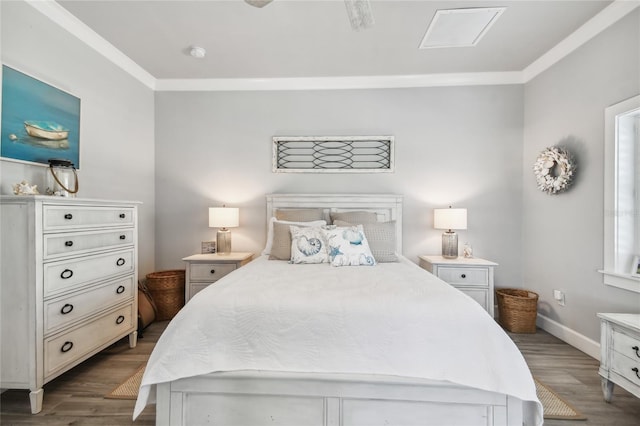 bedroom featuring crown molding and dark hardwood / wood-style floors