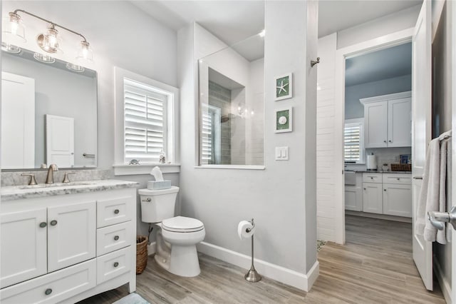 bathroom featuring hardwood / wood-style floors, vanity, and toilet