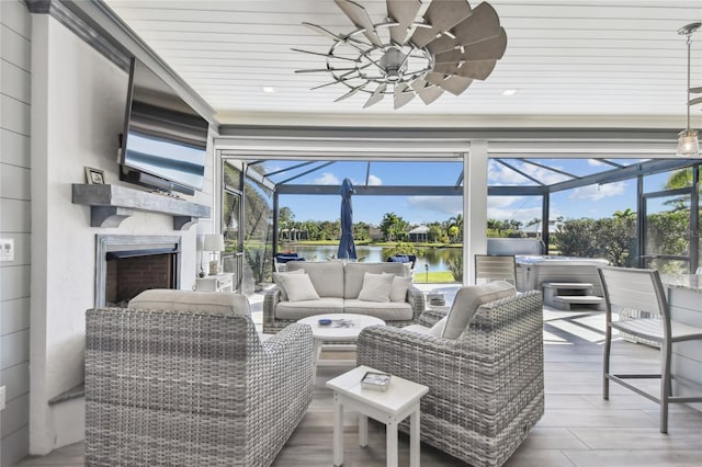 sunroom with a fireplace and wood ceiling