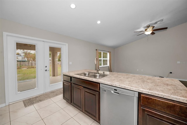 kitchen with ceiling fan, dishwasher, french doors, sink, and vaulted ceiling