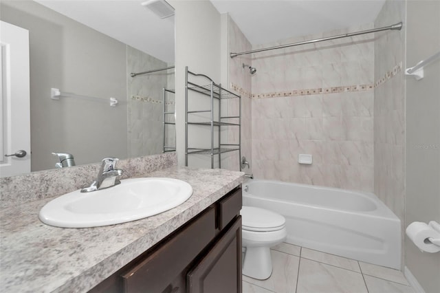 full bathroom with vanity, tiled shower / bath combo, and toilet