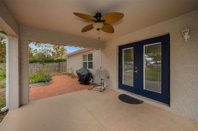 view of patio with french doors and ceiling fan