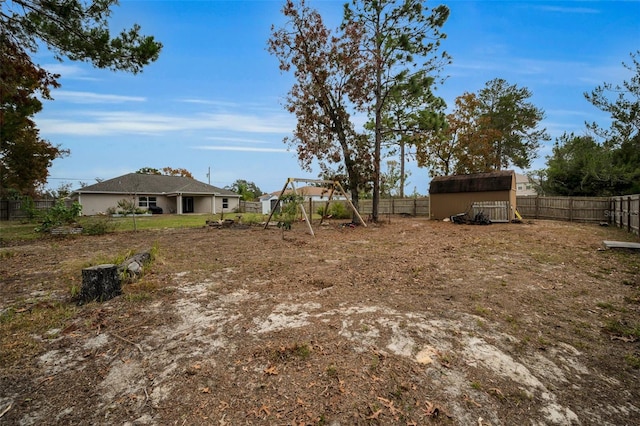 view of yard with a storage unit