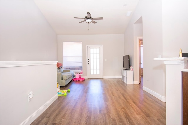 foyer entrance with hardwood / wood-style flooring and ceiling fan