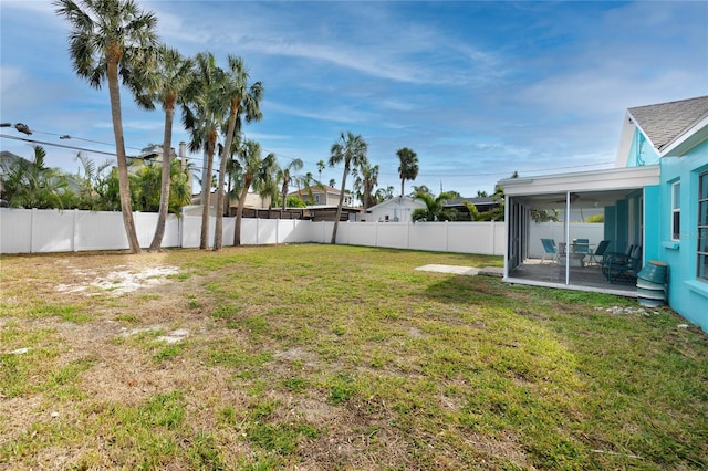 view of yard with a sunroom