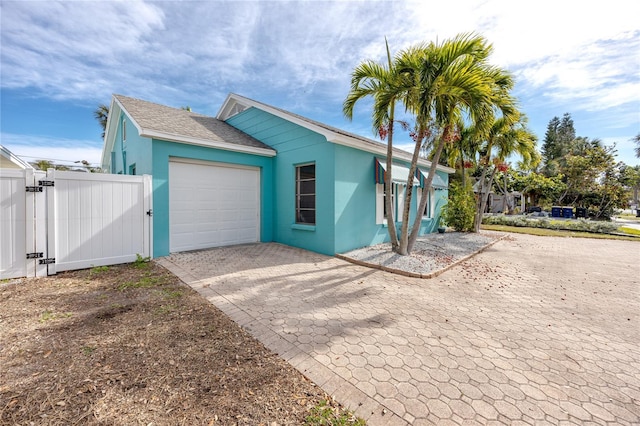 view of side of property featuring a garage