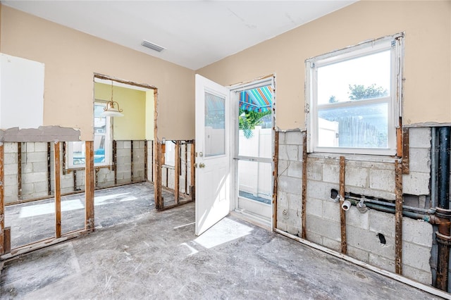 doorway with concrete flooring