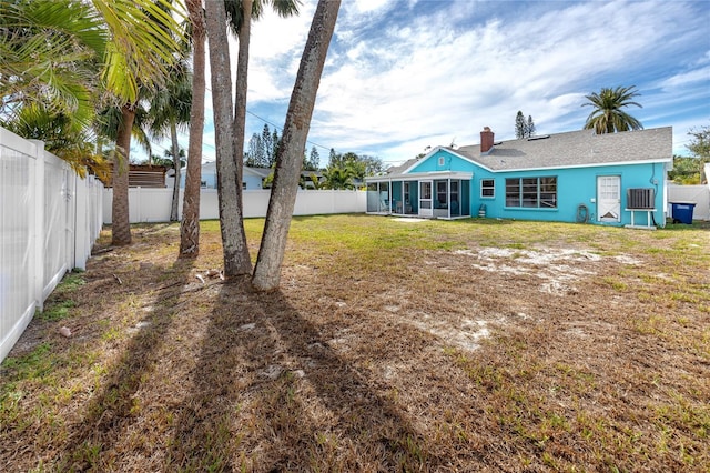 view of yard with a sunroom