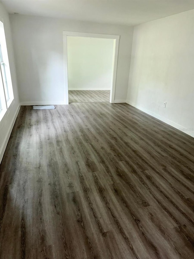 spare room featuring dark hardwood / wood-style floors