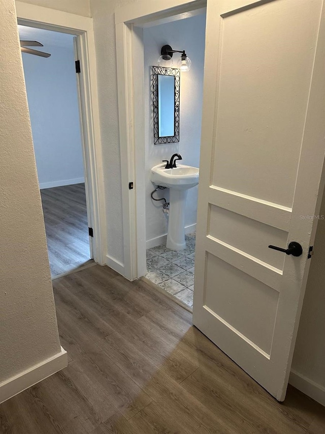 bathroom with hardwood / wood-style flooring