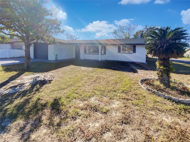 ranch-style home with a front yard