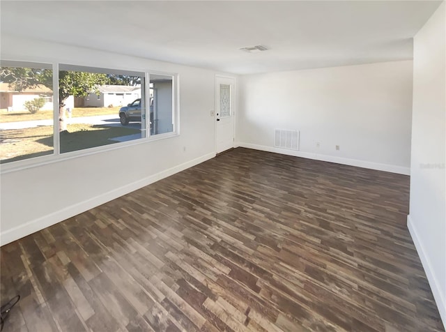 empty room with dark hardwood / wood-style floors