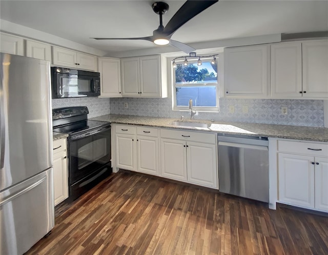 kitchen featuring black appliances, dark hardwood / wood-style flooring, white cabinetry, and sink