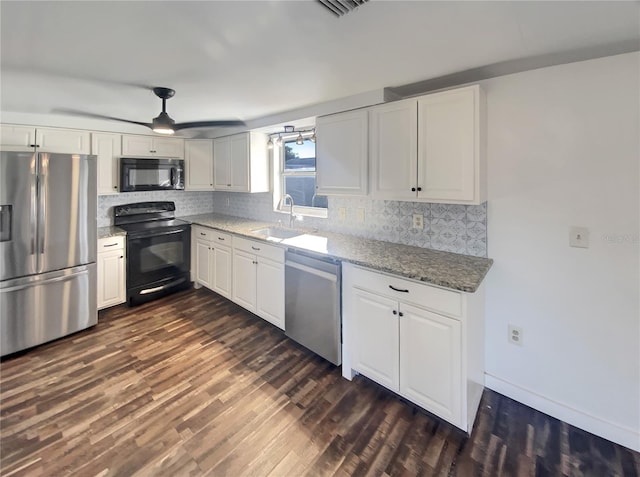 kitchen featuring sink, white cabinetry, dark wood-type flooring, and black appliances