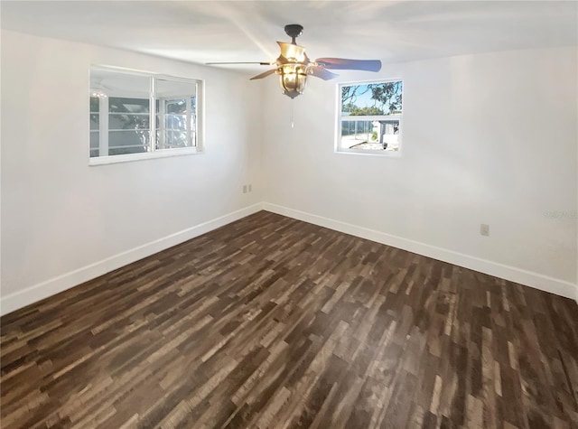 unfurnished room featuring ceiling fan and dark hardwood / wood-style flooring