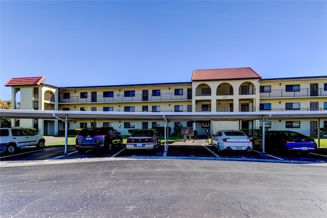 view of building exterior with covered parking