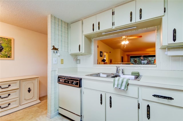 kitchen with white cabinetry, dishwasher, sink, a textured ceiling, and lofted ceiling