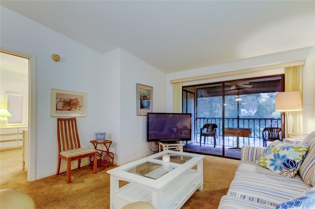 carpeted living room featuring lofted ceiling