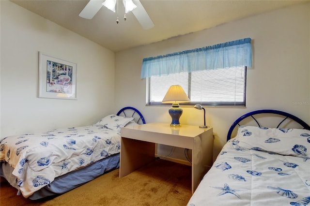 carpeted bedroom featuring lofted ceiling and ceiling fan