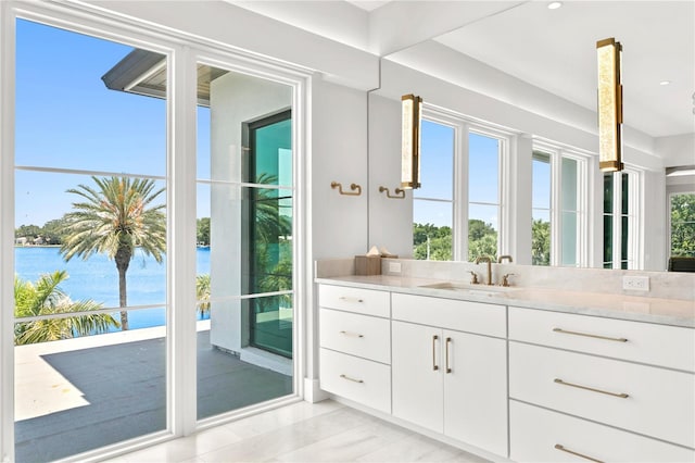 bathroom featuring vanity and a water view