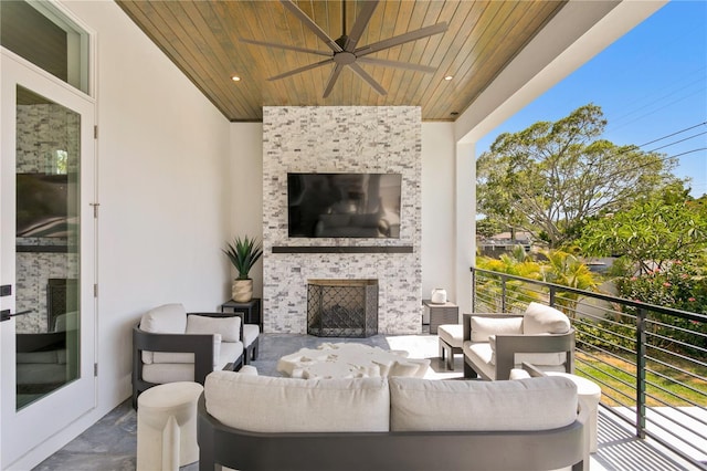 view of patio with ceiling fan, a balcony, and an outdoor hangout area