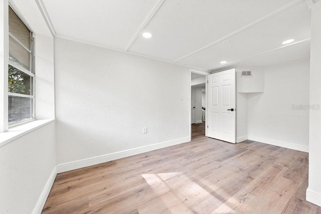 unfurnished room featuring light wood-type flooring