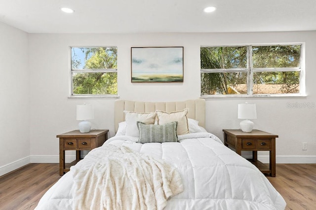 bedroom with light hardwood / wood-style floors