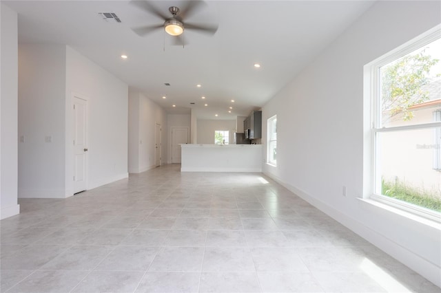479 Winwood Ct, Port Charlotte, FL 33954 - unfurnished living room with a ceiling fan, light tile patterned flooring, recessed lighting, and baseboards