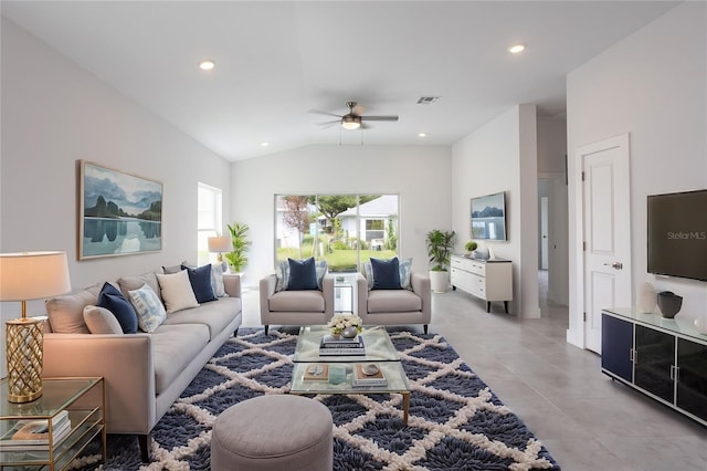 living room with ceiling fan and lofted ceiling