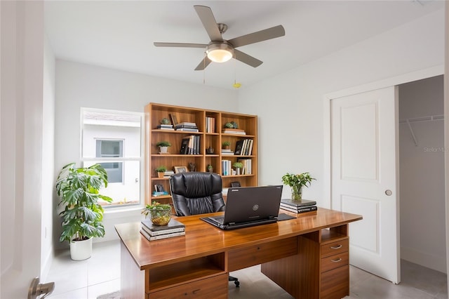 479 Winwood Ct, Port Charlotte, FL 33954 - home office featuring a ceiling fan, light tile patterned flooring, and baseboards