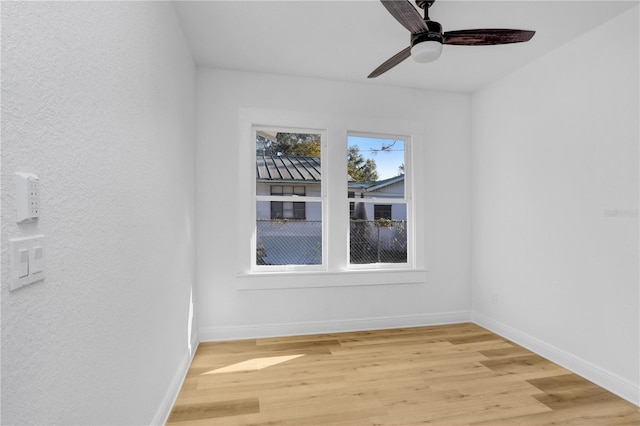 spare room featuring ceiling fan and light wood-type flooring