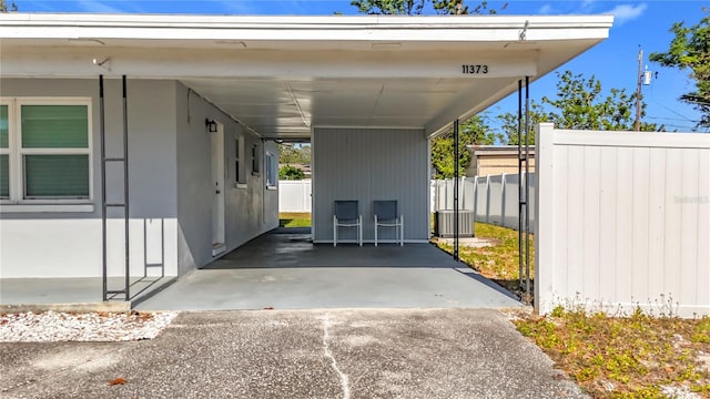 exterior space with a carport