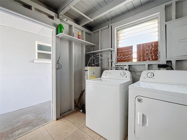 clothes washing area featuring wood ceiling, electric water heater, light tile patterned floors, and washer and dryer