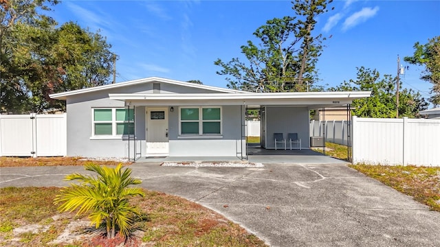 view of front facade with a carport