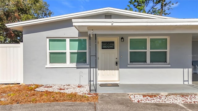 property entrance featuring covered porch