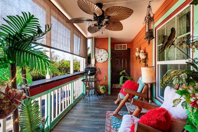 sunroom / solarium with ceiling fan