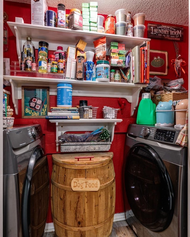 washroom with wood-type flooring, a textured ceiling, and independent washer and dryer