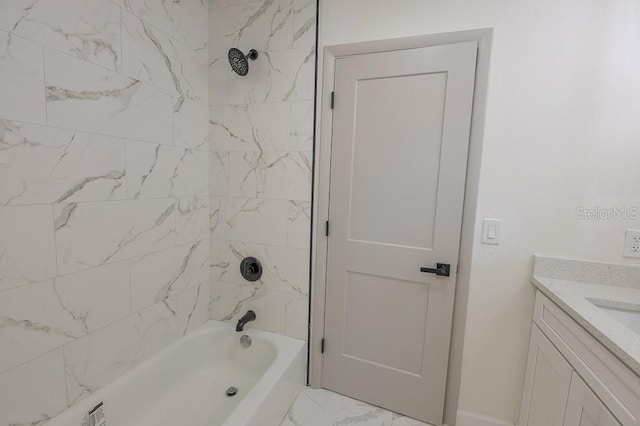 bathroom with vanity and tiled shower / bath combo