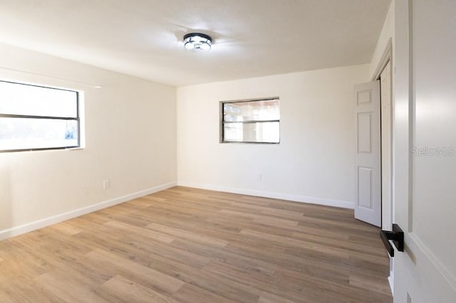 unfurnished room featuring hardwood / wood-style floors