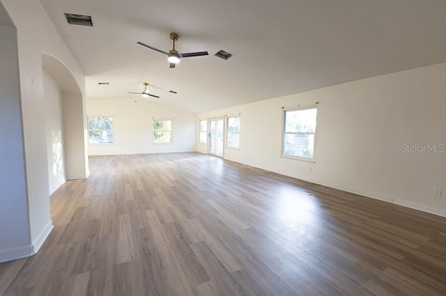 unfurnished living room featuring hardwood / wood-style floors, vaulted ceiling, and ceiling fan