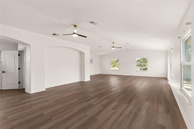 unfurnished living room featuring dark wood-type flooring, ceiling fan, and vaulted ceiling