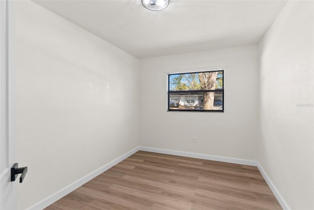 unfurnished room with light hardwood / wood-style flooring