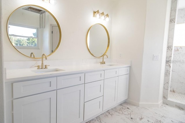 bathroom with vanity and a shower