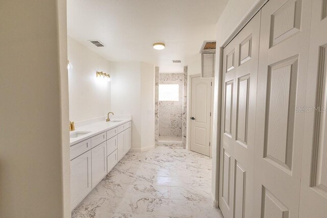 bathroom featuring vanity and a tile shower