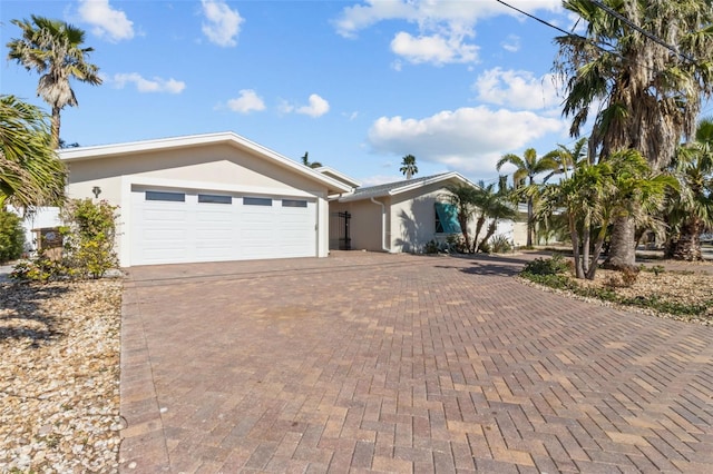 ranch-style house featuring a garage