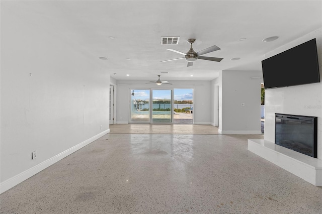 unfurnished living room with ceiling fan