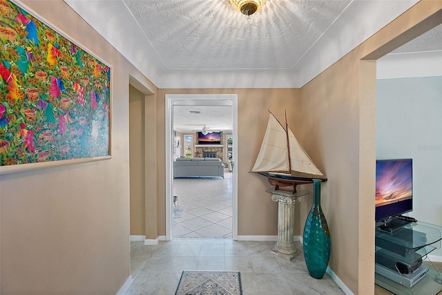 corridor with a textured ceiling