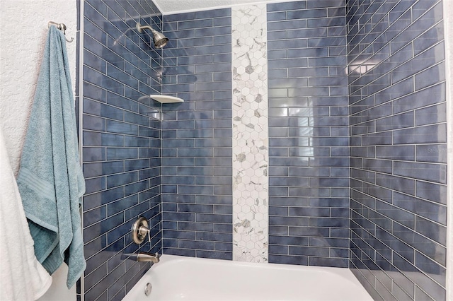 bathroom with tiled shower / bath combo