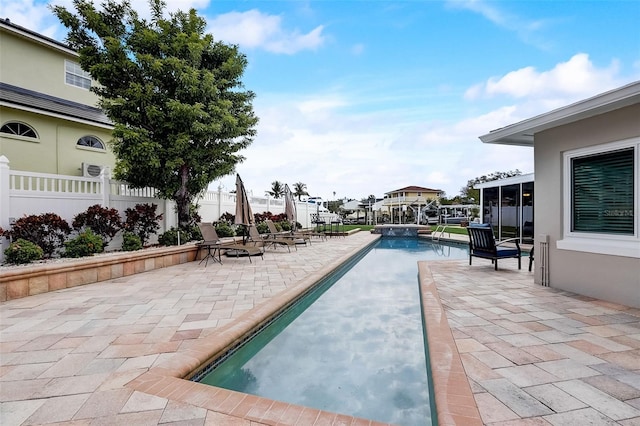 view of swimming pool with a patio area